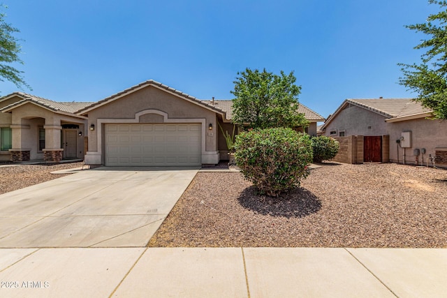 2191 W Goldmine Mountain Dr, Queen Creek, AZ 85144 - single story home featuring an attached garage, a tiled roof, stucco siding, concrete driveway, and fence
