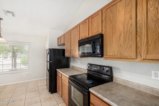 2191 W Goldmine Mountain Dr, Queen Creek, AZ 85144 - kitchen featuring black appliances, vaulted ceiling, light tile patterned floors, brown cabinets, and light countertops