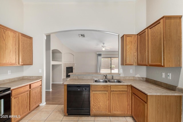 2191 W Goldmine Mountain Dr, Queen Creek, AZ 85144 - kitchen featuring black dishwasher, a sink, a ceiling fan, range with electric cooktop, and light tile patterned floors