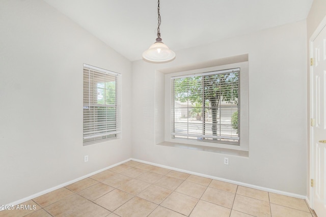 2191 W Goldmine Mountain Dr, Queen Creek, AZ 85144 - spare room featuring light tile patterned floors, healthy amount of natural light, vaulted ceiling, and baseboards