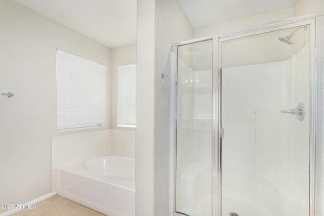 2191 W Goldmine Mountain Dr, Queen Creek, AZ 85144 - bathroom with a shower stall, tile patterned flooring, a bath, and baseboards