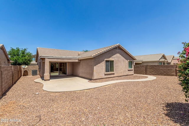 2191 W Goldmine Mountain Dr, Queen Creek, AZ 85144 - rear view of house with a tiled roof, stucco siding, a fenced backyard, and a patio