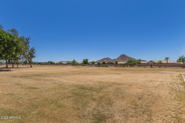 2191 W Goldmine Mountain Dr, Queen Creek, AZ 85144 - view of grassy yard featuring a mountain view