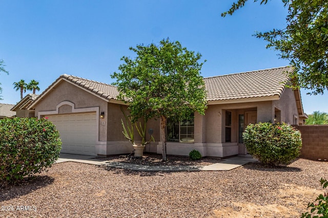 2191 W Goldmine Mountain Dr, Queen Creek, AZ 85144 - single story home featuring an attached garage, stucco siding, a tiled roof, and fence