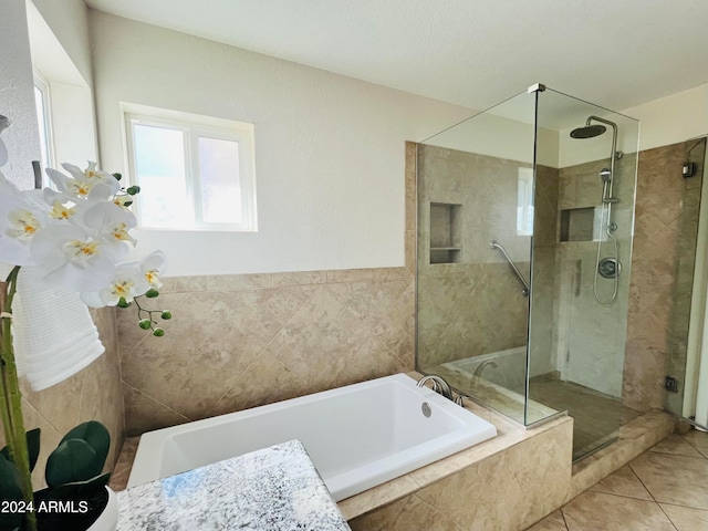 bathroom with tile patterned flooring and plus walk in shower