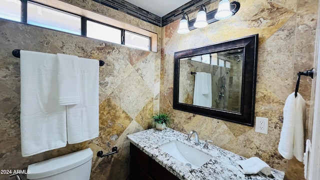 bathroom featuring crown molding, vanity, and toilet