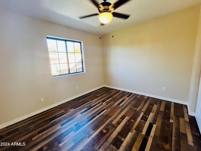 unfurnished room featuring ceiling fan and dark hardwood / wood-style flooring