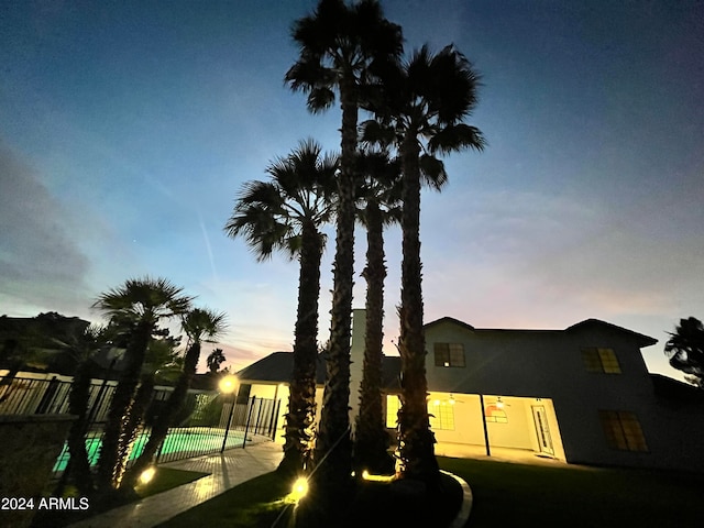 view of front facade with a patio and a pool