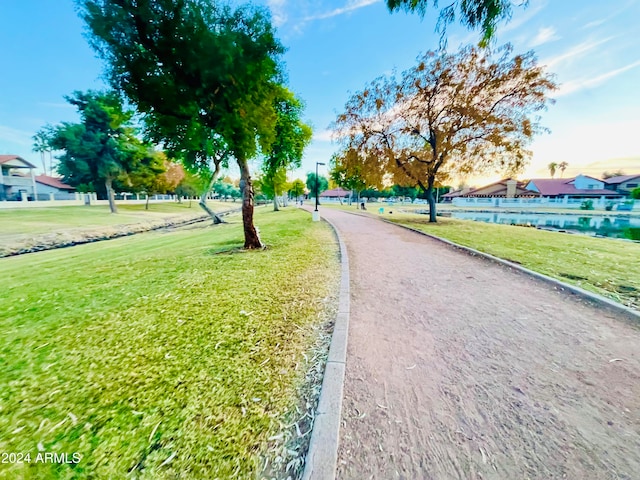 view of home's community featuring a lawn