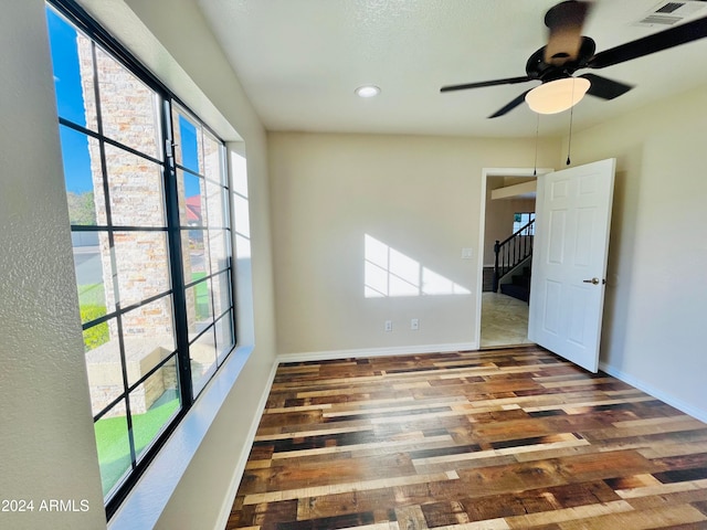 spare room featuring ceiling fan and wood-type flooring