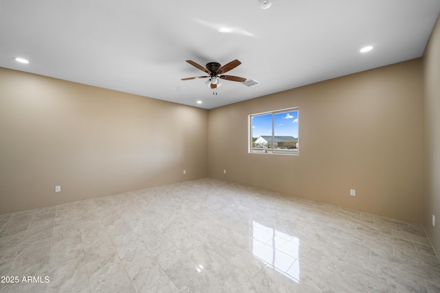 unfurnished room featuring ceiling fan