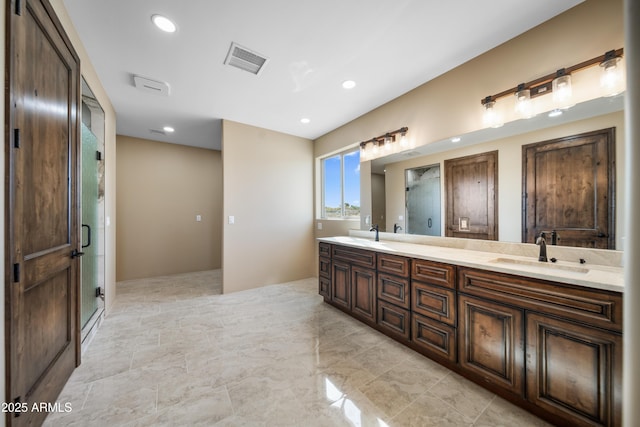 bathroom featuring vanity and walk in shower