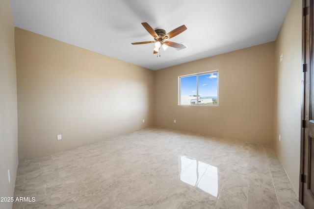 unfurnished room with ceiling fan