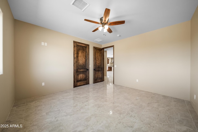 spare room featuring ceiling fan