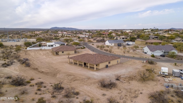 birds eye view of property with a mountain view