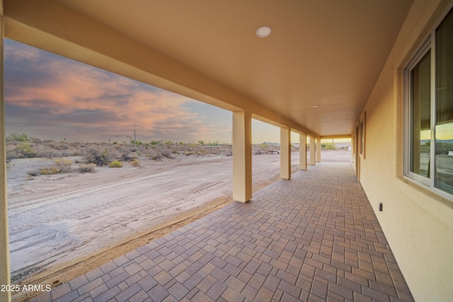 view of patio terrace at dusk