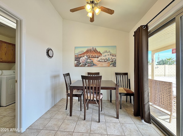 tiled dining space featuring vaulted ceiling and ceiling fan