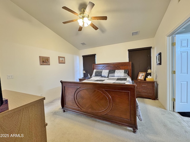 bedroom with ceiling fan, lofted ceiling, and light carpet