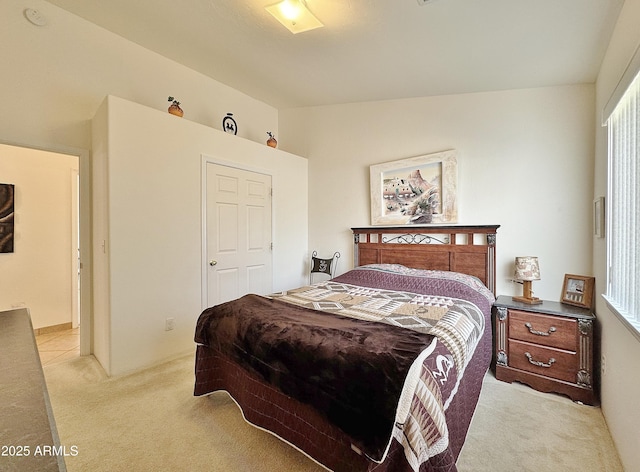 carpeted bedroom featuring vaulted ceiling