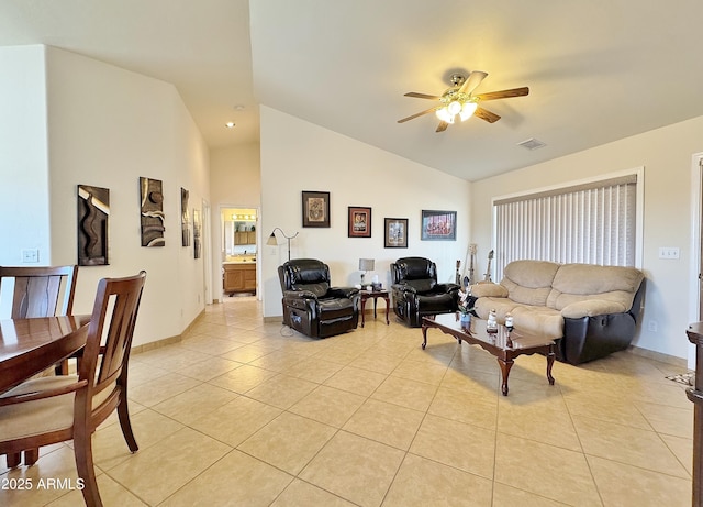 tiled living room with high vaulted ceiling and ceiling fan