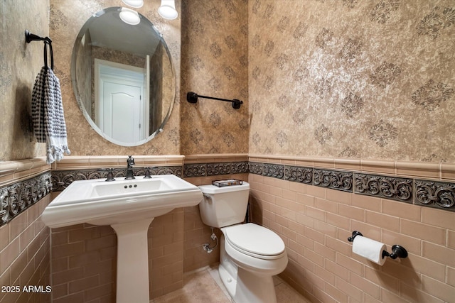 2470 E Roma Ave, Phoenix, AZ 85016 - half bathroom with wallpapered walls and wainscoting
