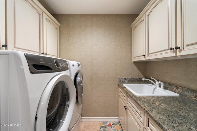 2470 E Roma Ave, Phoenix, AZ 85016 - washroom with cabinet space, washing machine and dryer, wallpapered walls, and light tile patterned flooring