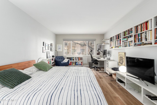 bedroom with light wood-style floors