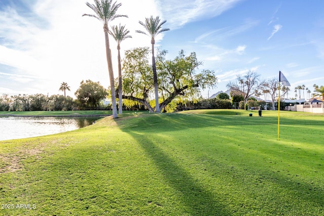 view of community featuring a water view and a lawn