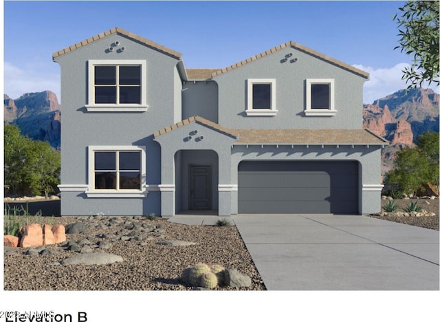 mediterranean / spanish house featuring a mountain view and a garage