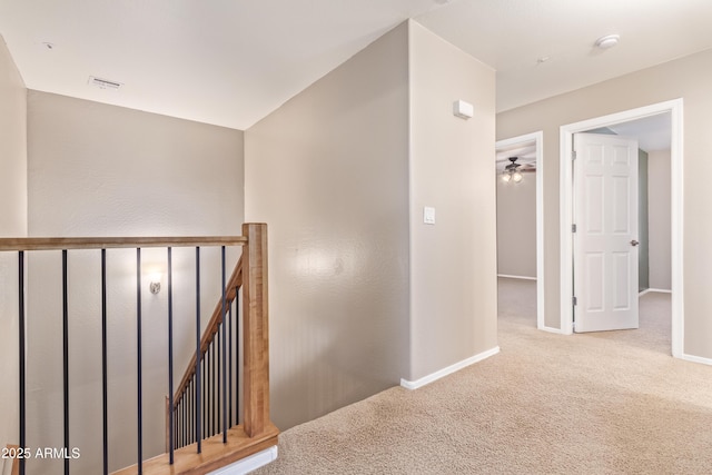 corridor with light carpet