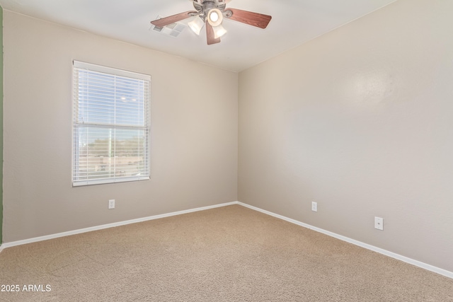 spare room with carpet and ceiling fan