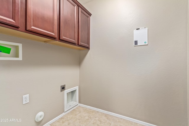 clothes washing area with electric dryer hookup, hookup for a gas dryer, and cabinets