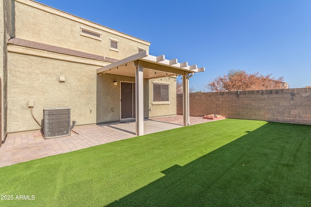 back of house featuring a lawn, a patio area, and central air condition unit