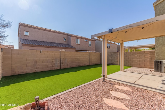 view of yard featuring central AC unit and a patio area