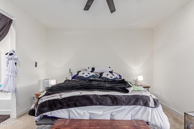 bedroom with light carpet and ceiling fan