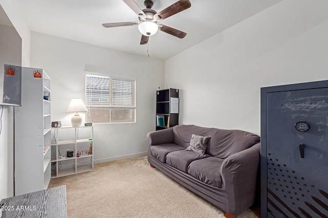 carpeted living room featuring ceiling fan