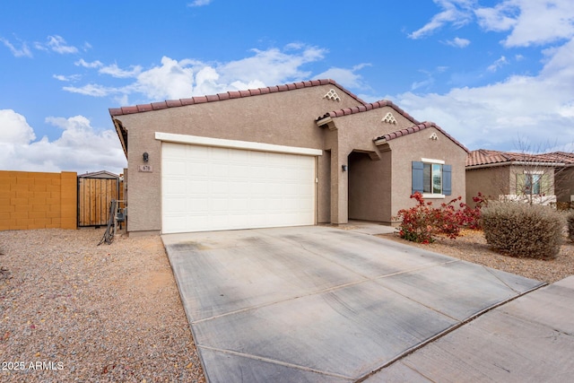 mediterranean / spanish-style home with a garage