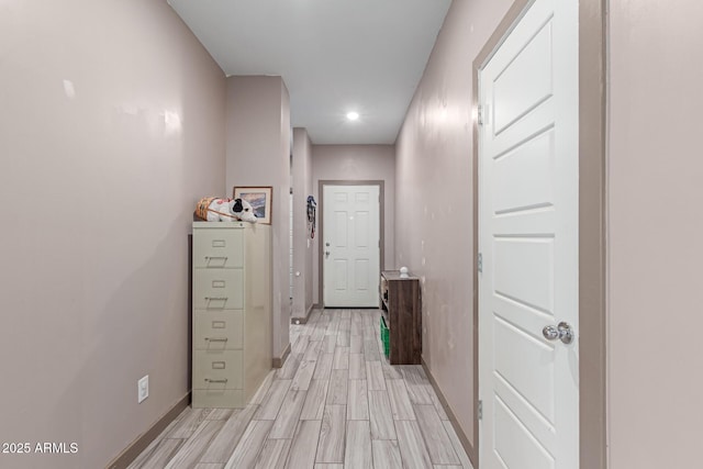 hallway with light wood-type flooring