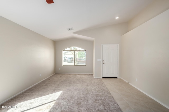 3847 W Yellow Peak Dr, San Tan Valley, AZ 85144 - unfurnished room with visible vents, light carpet, light tile patterned floors, baseboards, and vaulted ceiling