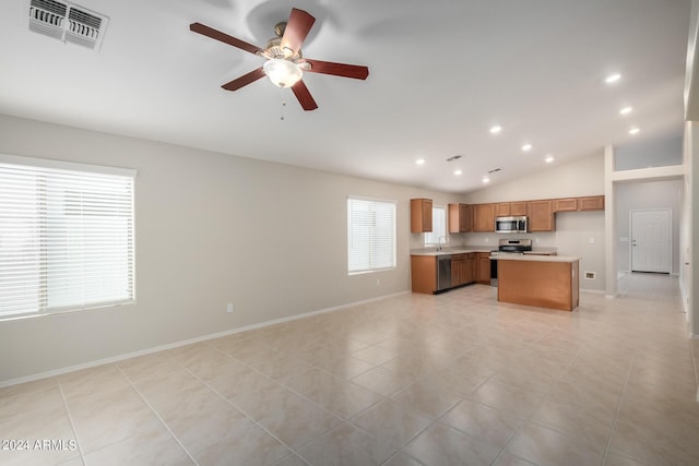 3847 W Yellow Peak Dr, San Tan Valley, AZ 85144 - kitchen featuring visible vents, brown cabinets, stainless steel appliances, and open floor plan