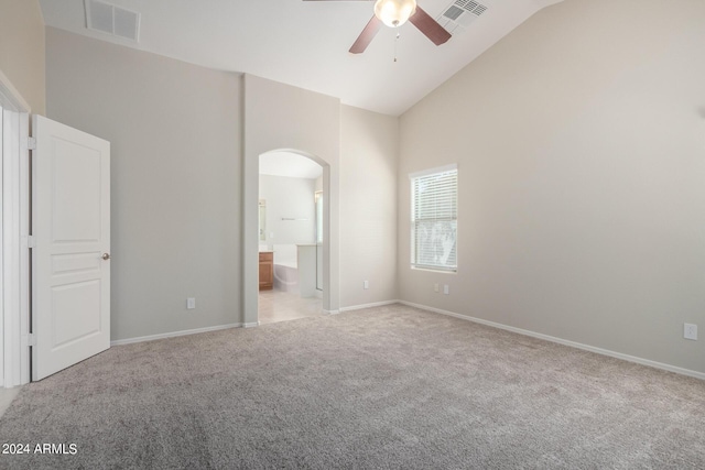 3847 W Yellow Peak Dr, San Tan Valley, AZ 85144 - unfurnished bedroom with arched walkways, visible vents, light colored carpet, and high vaulted ceiling