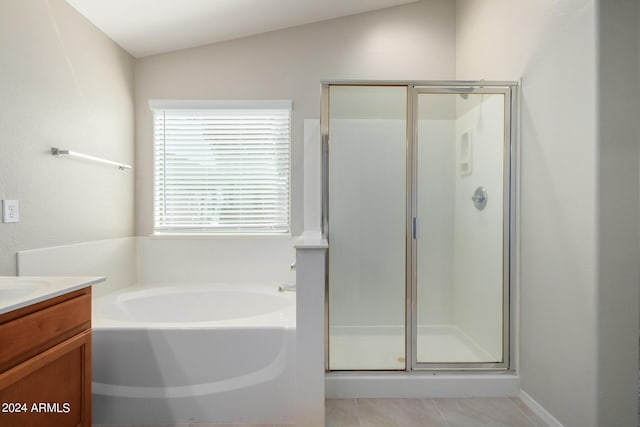 3847 W Yellow Peak Dr, San Tan Valley, AZ 85144 - full bathroom with tile patterned floors, a shower stall, vanity, and a garden tub