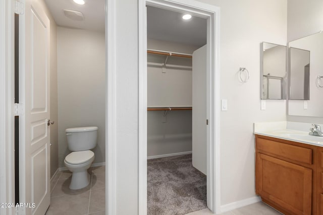 3847 W Yellow Peak Dr, San Tan Valley, AZ 85144 - full bath featuring toilet, tile patterned flooring, baseboards, a spacious closet, and vanity