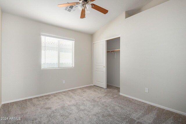3847 W Yellow Peak Dr, San Tan Valley, AZ 85144 - unfurnished bedroom with visible vents, lofted ceiling, a closet, carpet flooring, and baseboards