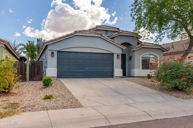 3847 W Yellow Peak Dr, San Tan Valley, AZ 85144 - mediterranean / spanish home featuring fence, driveway, stucco siding, a garage, and a tile roof