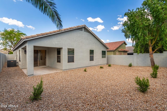 3847 W Yellow Peak Dr, San Tan Valley, AZ 85144 - back of house featuring a tile roof, cooling unit, a fenced backyard, and stucco siding