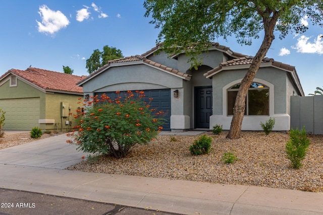 3847 W Yellow Peak Dr, San Tan Valley, AZ 85144 - mediterranean / spanish-style house with stucco siding, driveway, an attached garage, and a tile roof