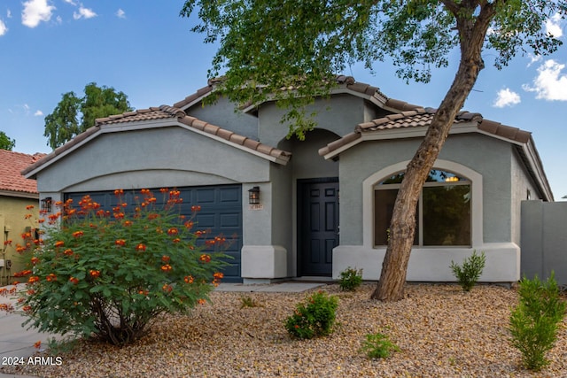 3847 W Yellow Peak Dr, San Tan Valley, AZ 85144 - mediterranean / spanish house with a garage, a tile roof, and stucco siding