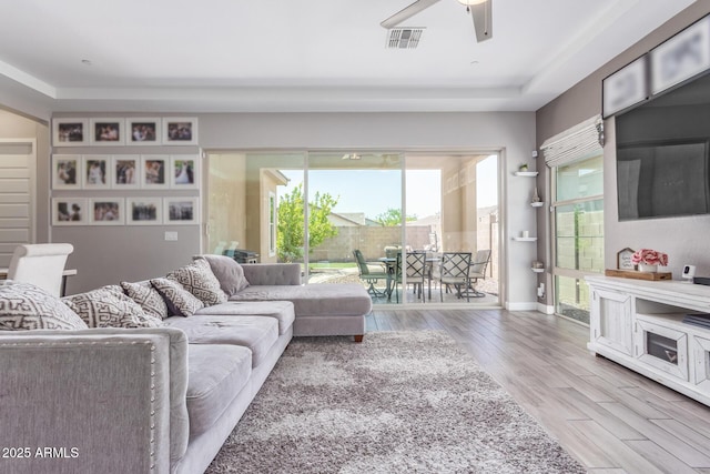 12083 W Peak View Rd, Peoria, AZ 85383 - living area featuring wood finished floors, ceiling fan, and baseboards