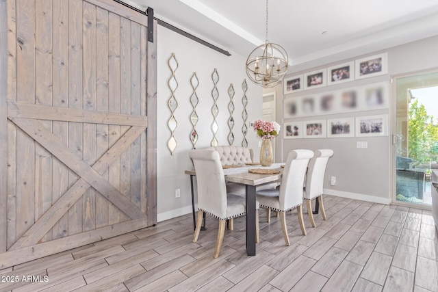 12083 W Peak View Rd, Peoria, AZ 85383 - dining area featuring wood finished floors, a chandelier, and baseboards